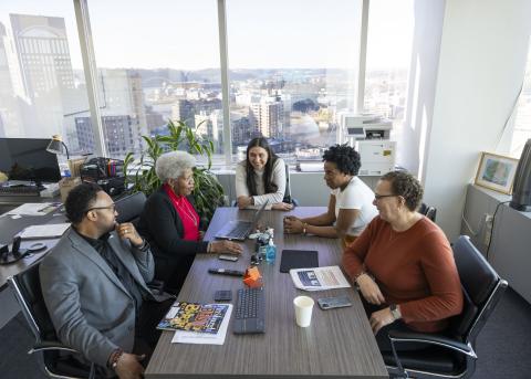 older adults at conference table older adults at conference table